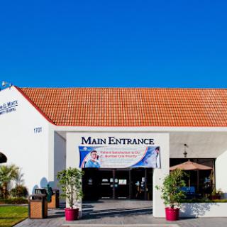 Main entrance of a building with clear blue skies.