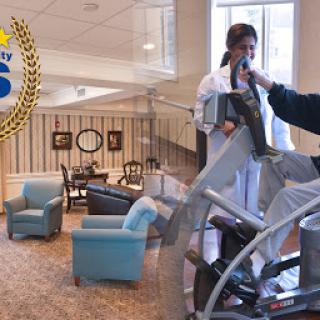 A healthcare facility featuring a rehabilitation area with fitness equipment and a comfortable waiting space.