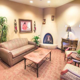 Cozy living room with a fireplace and comfortable seating.