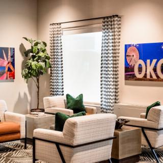 A modern living room with stylish furniture and decorative artwork.