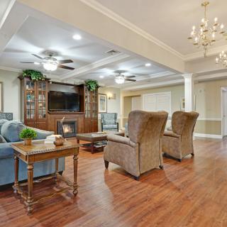 A spacious living room with elegant furniture and a cozy ambiance.