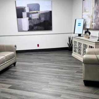 A modern lobby area with comfortable sofas and abstract artwork.