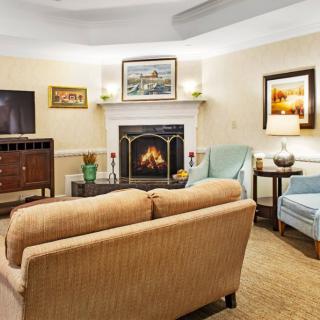 Cozy living room with a fireplace and comfortable seating.
