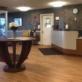 A welcoming reception area with a desk and decorative table centerpiece.