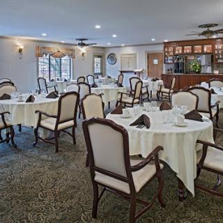 A spacious and elegantly arranged dining area ready for guests.