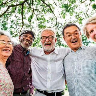 A group of happy seniors enjoying time together outdoors.