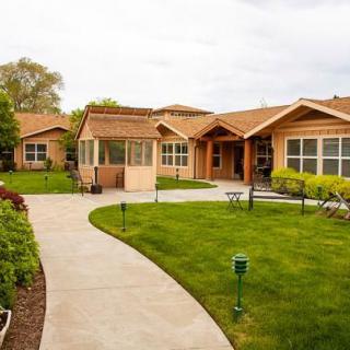 A beautiful house with a well-maintained lawn and garden.
