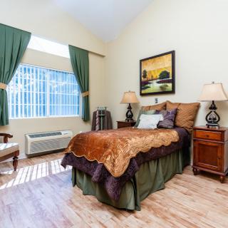 A cozy bedroom with elegant decor and natural light.