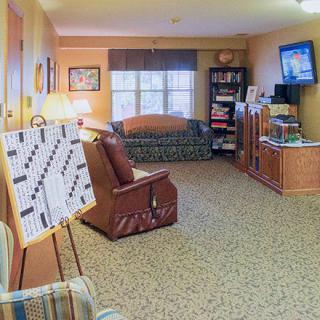 A cozy living room with comfortable seating and a television.