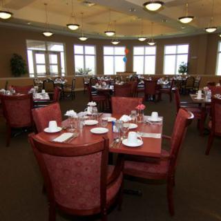 A spacious dining area with multiple tables set for service.