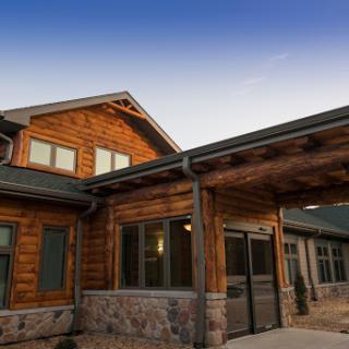 A beautifully designed wooden house showcasing modern architectural elements.