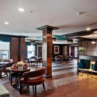 A stylish restaurant interior featuring elegant furniture and warm lighting.