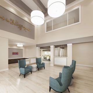 A modern lobby with elegant seating and contemporary lighting.