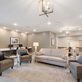 A modern living room with comfortable seating and elegant lighting.