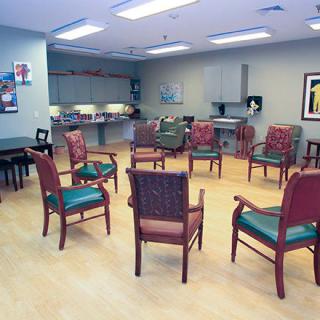 A community meeting room arranged with chairs in a circle.