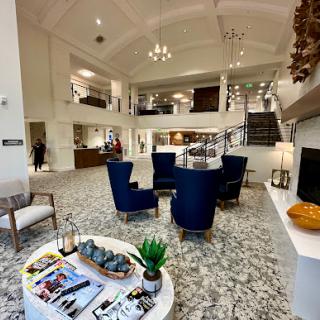 A spacious and elegantly designed hotel lobby with modern furnishings and a welcoming atmosphere.