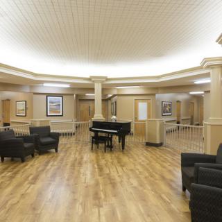 Spacious lobby area with a grand piano and comfortable seating.