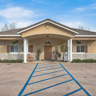 A well-maintained building with a welcoming entrance and accessible parking.