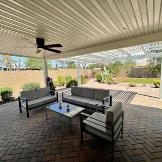 A modern outdoor lounge area with comfortable seating, perfect for relaxing and enjoying the fresh air.
