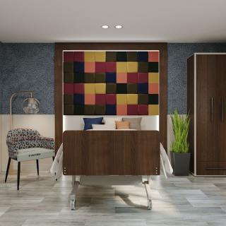 A modern living room featuring wooden cabinets, colorful artwork, a cozy armchair, and a potted plant.