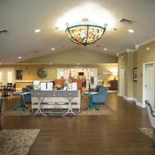 A welcoming lobby area with comfortable seating and a large chandelier.
