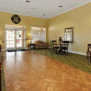 Spacious lobby area with seating and decorative elements.