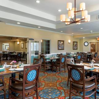 A well-decorated dining area with elegant furniture and ambient lighting.