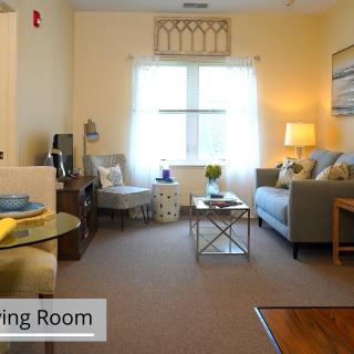 A cozy living room with comfortable seating and warm lighting.