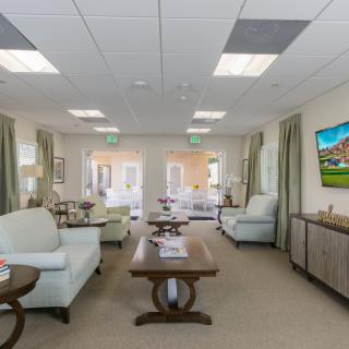 A spacious and well-lit waiting room with comfortable seating and modern decor.