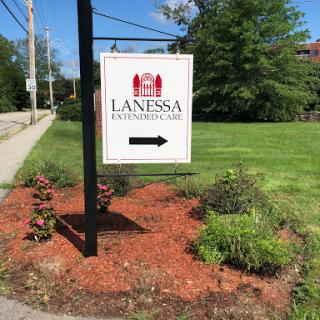 A directional sign for Lanesha, indicating the way forward.