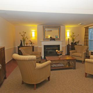 Cozy living room with comfortable seating and a fireplace.