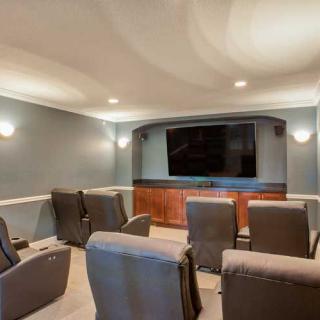 A cozy home theater with comfortable seating and a large screen for entertainment.