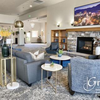A modern living room featuring a cozy fireplace, stylish furniture, and elegant decor.