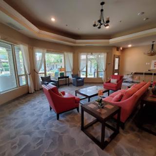 A cozy living room with comfortable seating and plenty of natural light.