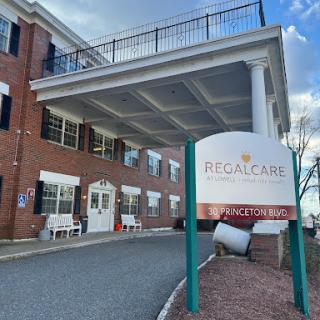 Exterior view of Regal Care facility with prominent signage.
