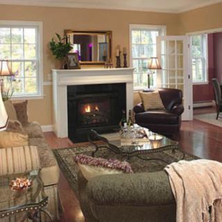 A cozy living room with a fireplace and comfortable seating.