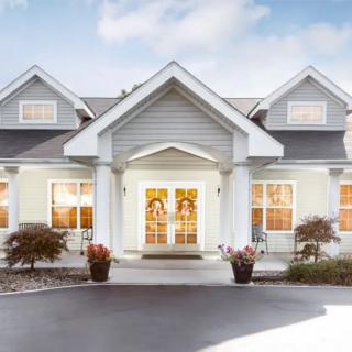 Elegant residential home with a welcoming front porch and garden.