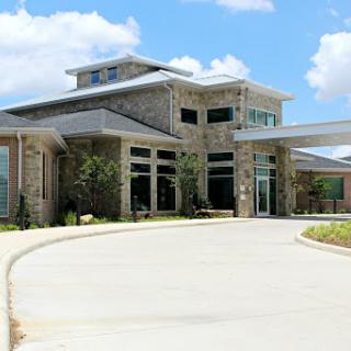 A contemporary residential building with a spacious entrance and modern architectural design.