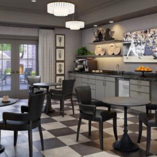 A cozy, modern cafe interior with checkered flooring and stylish seating arrangements.