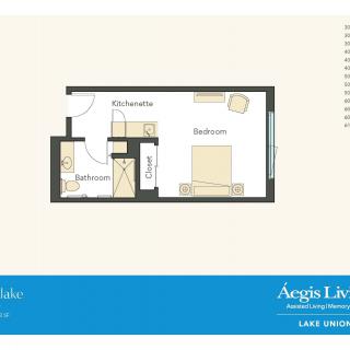 Studio apartment floor plan with kitchen, bathroom, and bedroom.