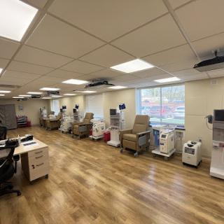 A well-organized healthcare facility with treatment chairs and medical equipment.