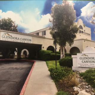 Entrance to Glendora Canyon Retirement Community with signage and landscaping.