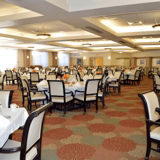 A spacious and elegantly arranged dining room, ready for guests.