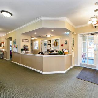 A welcoming reception area with a central desk and comfortable surroundings.
