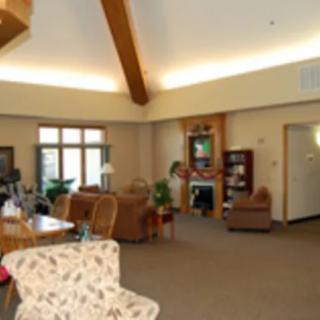 A cozy living room with comfortable seating and warm lighting.