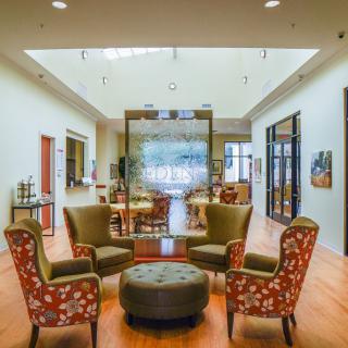 A modern lobby area with comfortable seating and bright lighting.