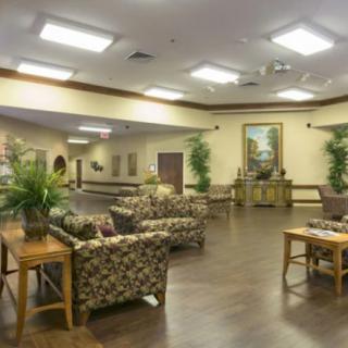 A spacious lounge area with comfortable seating and decorative elements.