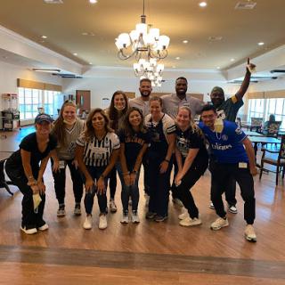 A joyful moment captured with friends and teammates, celebrating together indoors!