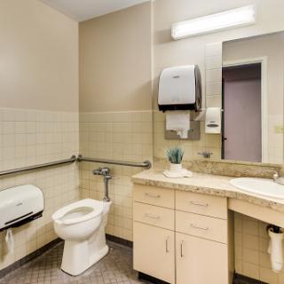 A clean and accessible bathroom with essential amenities.