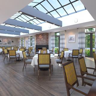 A spacious and modern restaurant dining area with tables and chairs under a large sunroof.